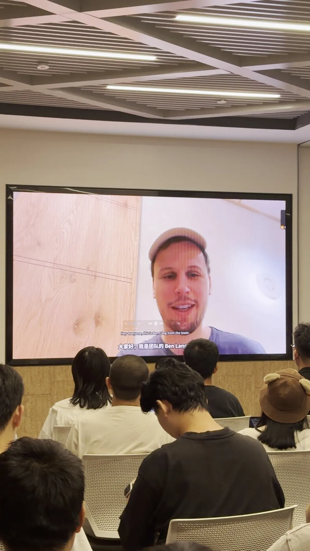 A video message from the Grok Bot team shown on screen to the audience
